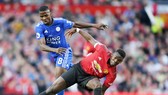 Paul Pogba (phải) thi đấu tập trung và quyết tâm ở trận khai mạc. Ảnh: Getty Images