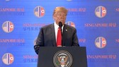 U.S. President Donald Trump speaks during a press conference in Singapore on June 12, 2018, in this photo captured from the website of The Straits Times. (Yonhap)
