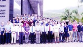 Delegates of the conferences and young science lovers are taking a photo in front of the ICISE