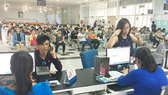 Passengers are waiting to buy train tickets at Sai Gon Railway Station