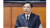 Minister Cuong speaks at the National Assembly session (Photo: SGGP)