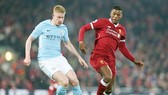 Georginio Wijnaldum (phải) tin tưởng Liverpool sẽ thắng trong cuộc đua với Man.City. Ảnh: Getty Images