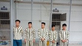 Một nhóm đối tượng bắt giữ người trái pháp luật trước đó. Ảnh: CHÍ THẠCH