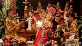 A practitioner is performing "len dong" (“going into a trance”), a spirit ritual involving music, singing, dance and costumes. (Photo: VNA)