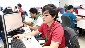 Software programmers work in Quang Trung Software City. Photo by Viet Dung