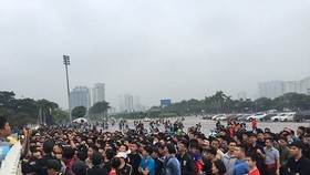 Thousands of Vietnamese football fans queue up in front of My Dinh National Stadium
