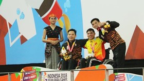 Võ Thanh Tùng (áo vàng) xuất sắc mang về tấm HCV cho Đoàn Việt Nam trong ngày thi đấu thứ tư. Ảnh: Vietnam+