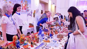 Visitors buy Russian traditional products at The Russian Consulate General in HCMC's booth