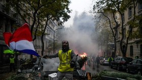 Macron surveys damage after Paris riots, calls for talks