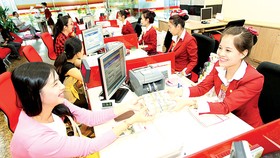 Giá USD tại các ngân hàng thương mại trong ngày 20-6 đã chạm mức 22.900 đồng/USD. Ảnh: HUY ANH