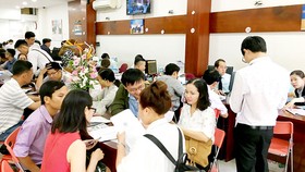 Hoạt động của một phòng công chứng trên địa bàn TPHCM. Ảnh: THÀNH TRÍ