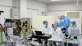Vietnamese engineers work to develop MicroDragon satellite.