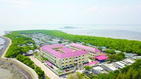 New school brightens up poor island district in HCMC