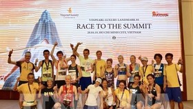 Top winners of the race pose for a group photo (Photo: VNA)