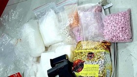 The drugs and weapon seized from the ring recently uncovered in HCM City (Source: VNA)