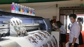 More environmentally friendly solutions for printing is important for the industry's sustainable development, according to a recent conference held in HCM City (Photo: VNA)