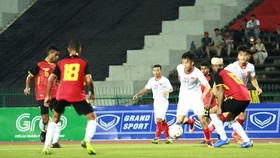 Vietnamese players (in white) in action (Photo: VNA)