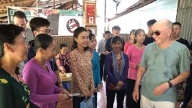 British billionaire Joe Lewis enjoys traditional cakes made by artisans in Con Son islet.