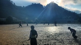 Children play a folk fame football in Huatat Village