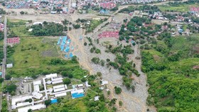 This aerial photo shows the area affected by flash floods in Sentani, Papua province, Indonesia, on March 18, 2019. Flash floods and mudslides triggered by downpours tore through mountainside villages in Indonesia’s easternmost province, killing dozens of