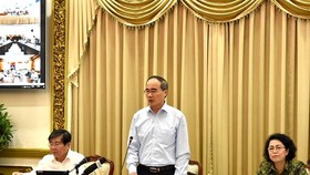 HCMC Party Leader Nguyen Thien Nhan makes a statement at the conference on administrative reform on July 18 (Photo: SGGP)