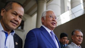 Najib (centre) is now facing dozens of charges for corruption, misappropriation of funds and abuse of power linked to the 1MDB.(Photo: EPA-EFE)
