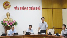 Ông Đỗ Ngọc Huỳnh (đứng) phát biểu trong một buổi lễ năm 2015. Ảnh: VGP