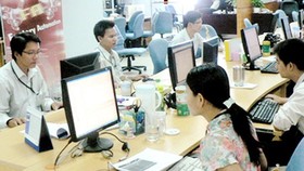 Chuyên viên phần mềm Việt Nam làm việc tại Công ty Global CyberSoft trong Công viên Phần mềm Quang Trung. Ảnh: T.Ba