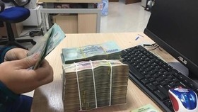 Theo đơn phản ánh, mặc dù không đi vay nợ nhưng một số người tiêu dùng liên tục bị gọi điện thoại, đe dọa, ép buộc trả nợ. (Ảnh: PV/Vietnam+)
