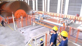 The US has been carrying out antidumping investigation on made-in-Vietnam plywood. (Photo: SGGP)