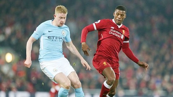 Georginio Wijnaldum (phải) tin tưởng Liverpool sẽ thắng trong cuộc đua với Man.City. Ảnh: Getty Images