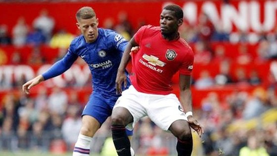 HLV Ole Gunnar Solskjaer tin Paul Pogba (phải) ở lại và sẽ tỏa sáng trong mùa này. Ảnh: Getty Images