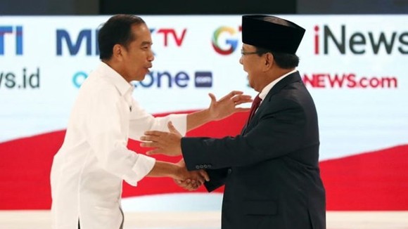 Presidential candidates Joko Widodo (left) and Prabowo Subianto shake hands during a debate among candidates in Jakarta, Indonesia, on Feb 17, 2019. (Source: EPA-EFE)