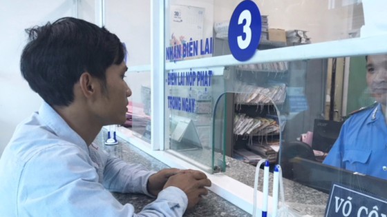 Xã hội hóa hành chính công: Nhà nước bớt “ôm”, dân tiện lợi ảnh 1