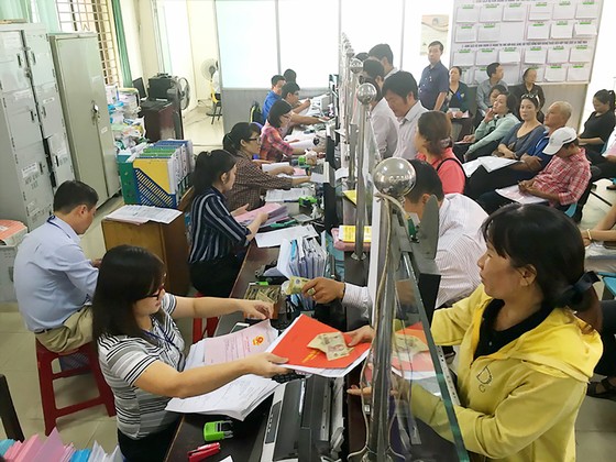 Cần phân cấp triệt để việc cấp giấy chứng nhận nhà đất ảnh 1
