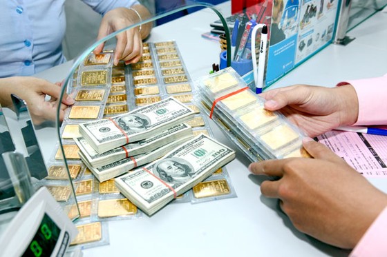 Vàng và USD lặng sóng ảnh 1