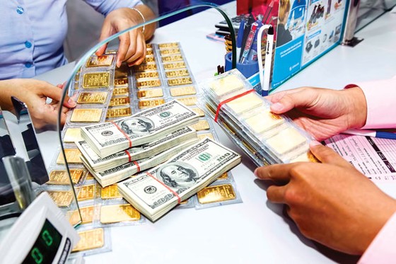 Vàng, USD phản ứng chậm với giá thế giới ảnh 1