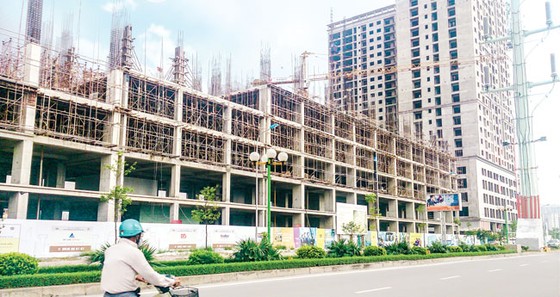 Thị trường bất động sản: Cung tắc, dễ đầu cơ kích giá ảnh 1