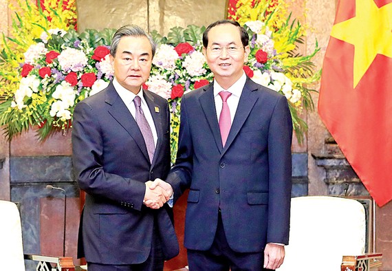 Chủ tịch nước Trần Đại Quang tiếp Ủy viên Quốc vụ, Bộ trưởng Bộ Ngoại giao Trung Quốc Vương Nghị. Ảnh: TTXVN