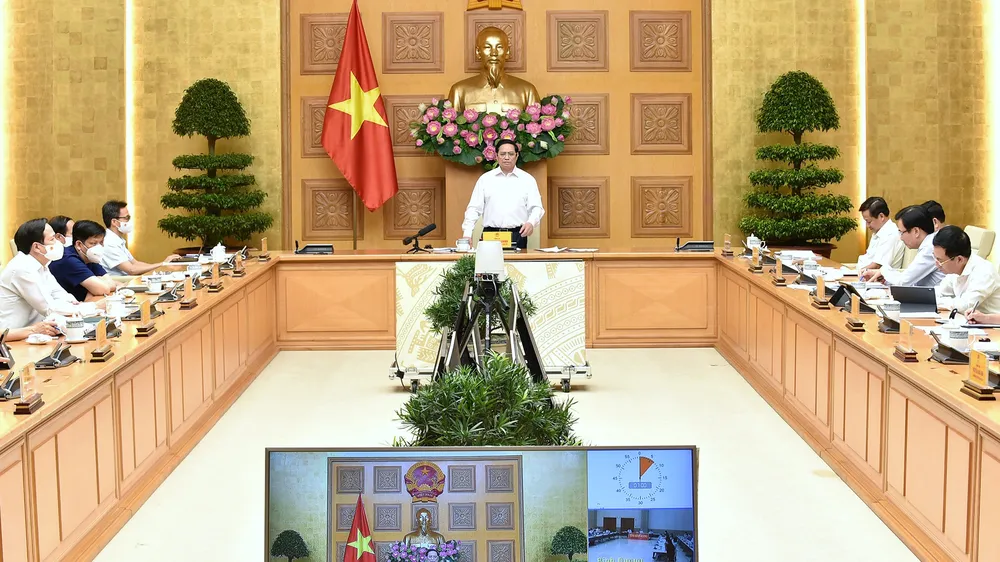 Thủ tướng Phạm Minh Chính chủ trì cuộc họp trực tuyến của Thường trực Chính phủ với TPHCM và các tỉnh Bình Dương, Đồng Nai, Long An. Ảnh: VIẾT CHUNG