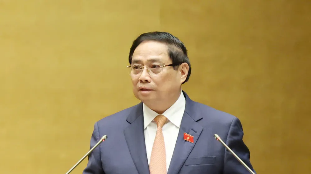 Thủ tướng Phạm Minh Chính trình bày báo cáo kết quả thực hiện kế hoạch phát triển kinh tế - xã hội năm 2025 và 5 năm 2021-2025; dự kiến kế hoạch phát triển kinh tế - xã hội năm 2026. Ảnh: QUANG PHÚC