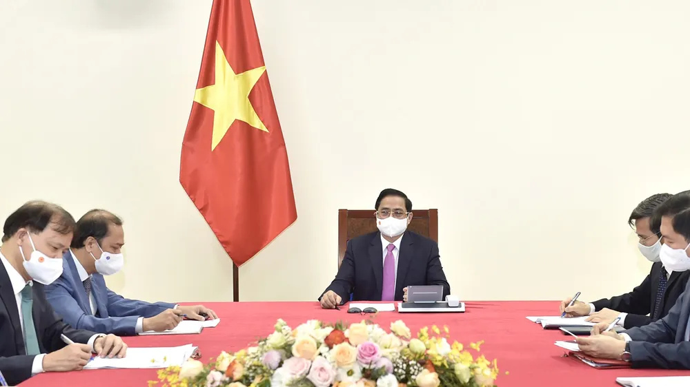 Thủ tướng Chính phủ Phạm Minh Chính điện đàm với Thủ tướng Thái Lan Prayut Chan-o-cha. Ảnh: VIẾT CHUNG