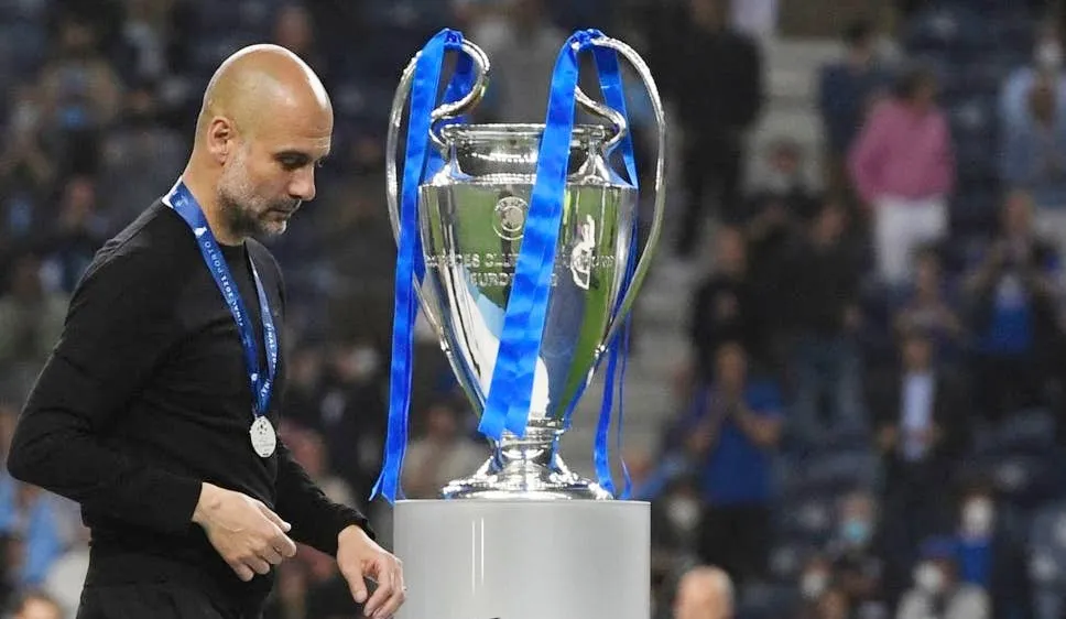 Pep Guardiola lặng lẽ bước qua danh hiệu mà ông chờ đợi suốt 10 năm qua. Ảnh: Getty Images