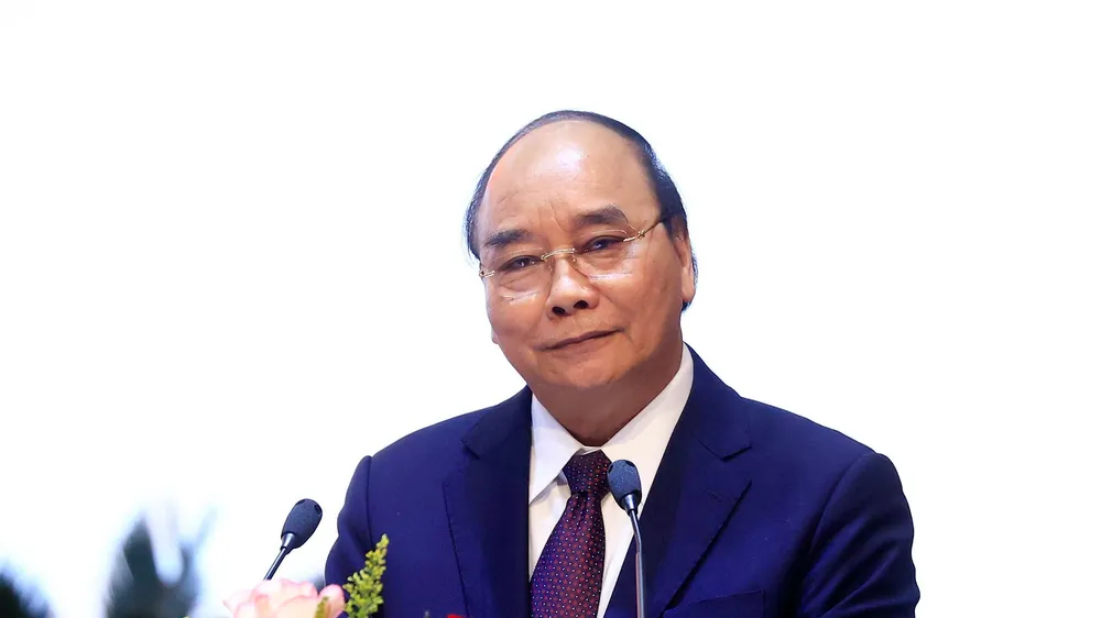 Chủ tịch nước Nguyễn Xuân Phúc phát biểu tại Hội nghị quán triệt và triển khai tổng kết 10 năm thực hiện Nghị quyết Trung ương 8 khóa XI. Ảnh: TTXVN