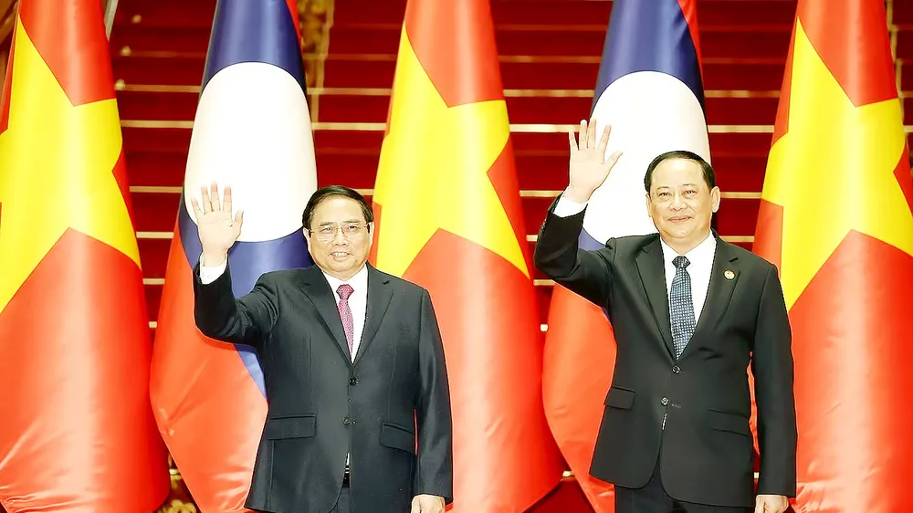 Thủ tướng Phạm Minh Chính và Thủ tướng Lào Sonexay Siphandone. Ảnh: TTXVN