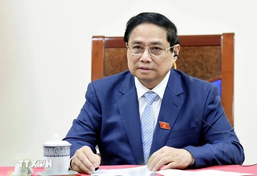 Thủ tướng Phạm Minh Chính điện đàm với Thủ tướng Singapore Lawrence Wong. Ảnh: TTXVN