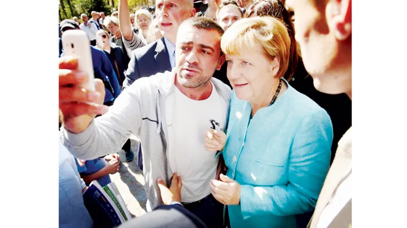 Thủ tướng Đức Angela Merkel thăm một trại của người tị nạn tại Berlin