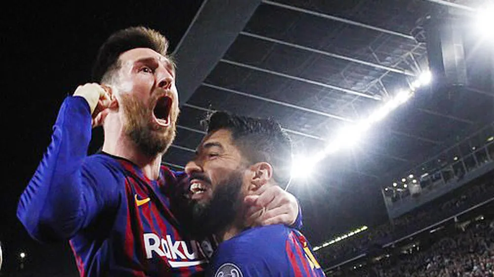 Messi và Suarez cùng ghi bàn giúp Barcelona thắng Liverpool. Ảnh: Reuters