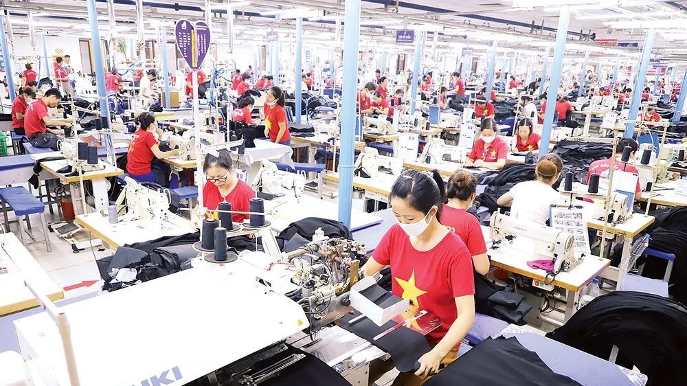 Dù chịu tác động nặng nề của dịch Covid-19, kinh tế Việt Nam đã thể hiện được khả năng phục hồi đáng nể. Ảnh: QUANG PHÚC
