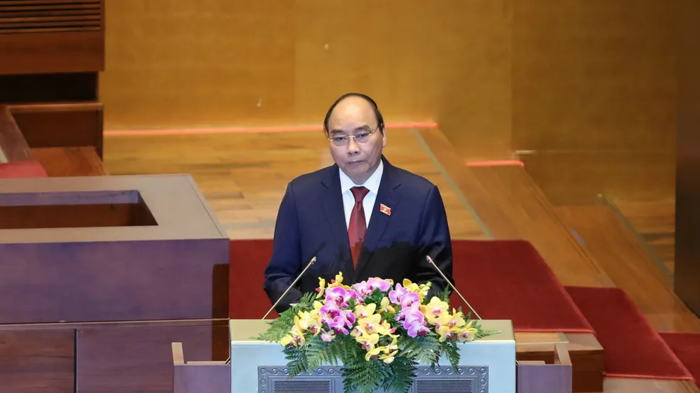 Chủ tịch nước Nguyễn Xuân Phúc trình phê chuẩn miễn nhiệm Phó Chủ tịch và một số Ủy viên Hội đồng Quốc phòng và An ninh. Ảnh: QUANG PHÚC